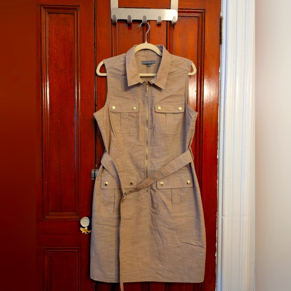 Mid thigh beige/camel shirt dress with metal details.